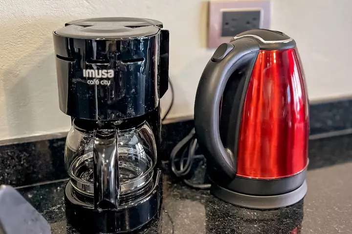 Coffee maker and electric kettle on the kitchen counter