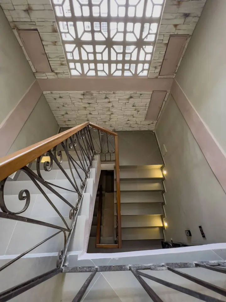 Stairwell with wrought-iron railing