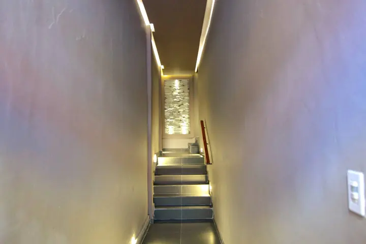 Lit staircase leading up to the apartments