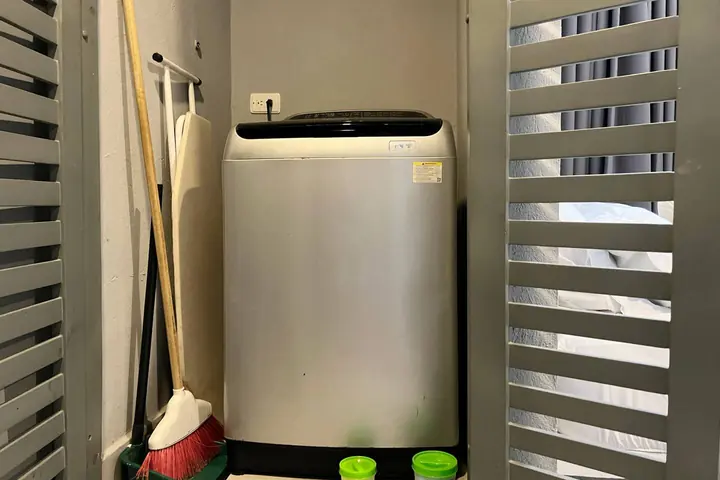 Washing machine in the utility cupboard